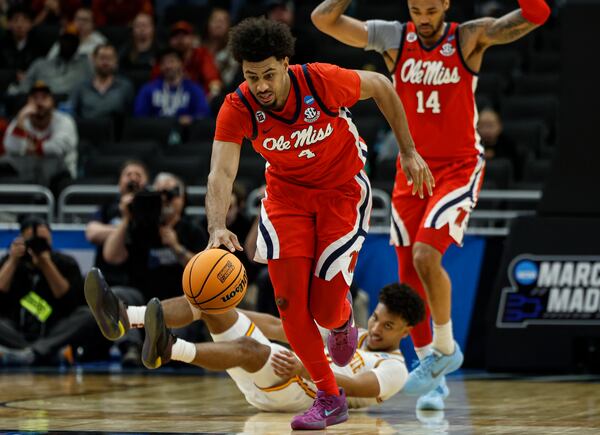 Mississippi forward Jaemyn Brakefield (4) picks up a loose ball against Iowa State during the second half in the second round of the NCAA college basketball tournament Sunday, March 23, 2025, in Milwaukee. (AP Photo/Jeffrey Phelps)