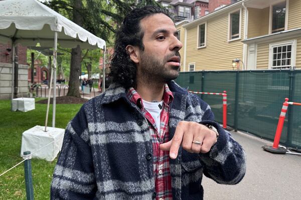 Walid Akef, an Egyptian graduate student in art history speaks about the Trump administration's decision to revoke the school's ability to enroll international students on the Harvard University campus in Cambridge, Mass., on Friday, May 23, 2025. (AP Photo/Michael Casey)