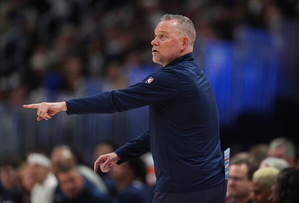 Denver Nuggets head coach Michael Malone directs his team against the Los Angeles Lakers in the first half of an NBA basketball game Saturday, Feb. 22, 2025, in Denver. (AP Photo/David Zalubowski)