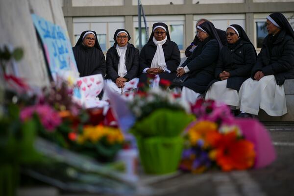 Nuns pray for Pope Francis in front of the Agostino Gemelli Polyclinic, in Rome, Thursday, Feb. 27, 2025, where Pope Francis is hospitalized since Friday, Feb. 14. (AP Photo/Andrew Medichini)