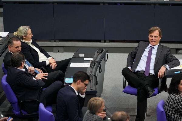 FILE - From right, Bernd Baumann, Alice Weigel and Tino Chrupalla, lawmakers of the Alternative for Germany, AfD, attend a debate about migration at the German parliament Bundestag in Berlin, Germany, Jan. 29, 2025. (AP Photo/Markus Schreiber, File)