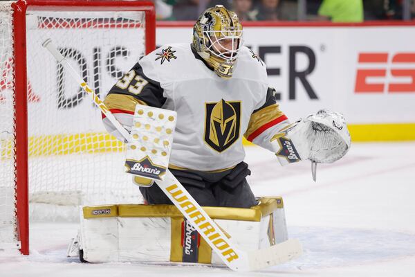 Vegas Golden Knights goaltender Adin Hill watches the play during the first period of Game 6 of a first-round NHL hockey playoff series against the Minnesota Wild, Thursday, May 1, 2025, in St. Paul, Minn. (AP Photo/Bailey Hillesheim)