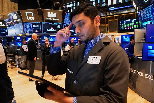 Trader Niall Pawa works on the floor of the New York Stock Exchange, Friday, May 2, 2025. (AP Photo/Richard Drew)