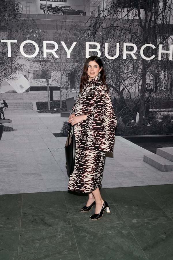 Alexandra Daddario arrives at the Tory Burch Fall/Winter 2025 fashion show as part of New York Fashion Week on Monday, Feb. 10, 2025, at the Museum of Modern Art in New York. (Photo by Charles Sykes/Invision/AP)