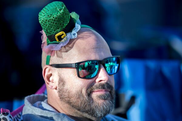 Michael Popovich from Houston, wears a tiny leprechaun hat he got from his niece during the St. Patrick's Day parade, Monday, March 17, 2025, in Savannah, Ga. (AP Photo/Stephen B. Morton)