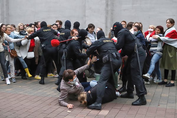 FILE - Police officers detain protesters at a rally in Minsk, Belarus, on Sept. 8, 2020, in support of opposition figure Maria Kolesnikova. (AP Photo, File)