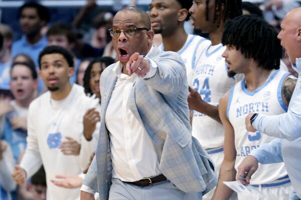 North Carolina head coach Hubert Davis yells instructions to the team during the first half of an NCAA college basketball game against Duke, Saturday, March 8, 2025, in Chapel Hill, N.C. (AP Photo/Chris Seward)