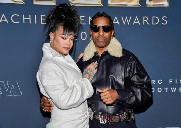 FILE - Collaboration of the year honoree A$AP Rocky, right, and Rihanna attend the 38th annual Footwear News Achievement Awards at Cipriani South Street on Dec. 4, 2024, in New York. (Photo by Evan Agostini/Invision/AP, file)