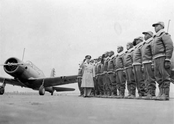 Cadets at the Basic and Advanced Flying School for Negro Air Corps Cadets are shown, Jan. 23, 1942, lined up for review with Major James A. Ellison, who is returning the salute of Mac Ross of Dayton, Ohio, as he inspects the cadets. (AP Photo/U.S. Army Signal Corps)