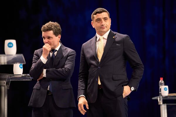 FILE - Presidential candidates Nicusor Dan, left, and George Simion take a break during a live electoral debate ahead of the second round of the country's presidential election redo in Bucharest, Romania, Thursday night, May 8, 2025. (AP Photo/Vadim Ghirda, File)
