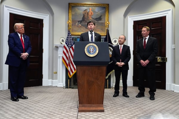 Sam Altman, OpenAI CEO, speaks as President Donald Trump, left, Masayoshi Son, SoftBank Group CEO, third from left, and, Larry Ellison, chairman of Oracle Corporation and chief technology officer, right, listen, in the Roosevelt Room at the White House, Tuesday, Jan. 21, 2025, in Washington. (AP Photo/Julia Demaree Nikhinson)