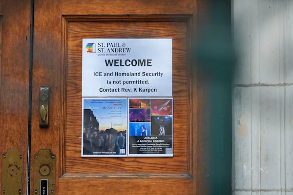 A sign that prohibits the entrance of ICE or Homeland Security is posted on a door at St. Paul and St. Andrew United Methodist Church in New York, Tuesday, Jan. 21, 2025. (AP Photo/Seth Wenig)