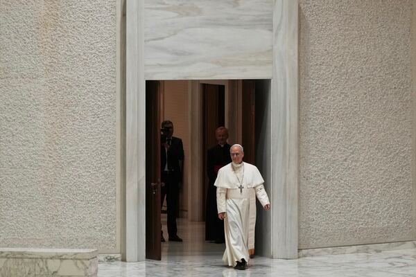 Pope Leo XIV arrives to meet with members of the international media in the Paul VI Hall at the Vatican, Monday, May 12, 2025. (AP Photo/Domenico Stinellis)