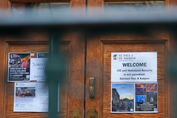 A sign that prohibits the entrance of ICE or Homeland Security is posted on a door at St. Paul and St. Andrew United Methodist Church in New York, Tuesday, Jan. 21, 2025. (AP Photo/Seth Wenig)