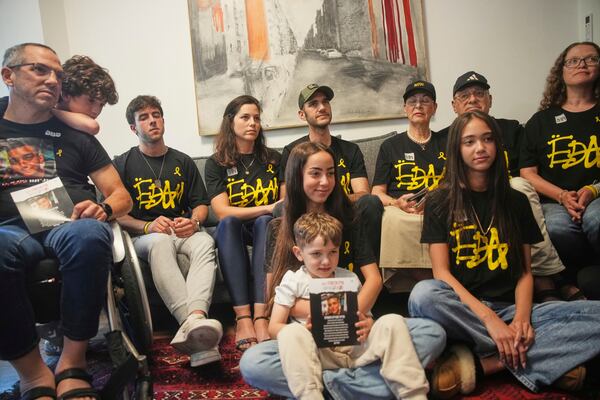 Relatives and friends of Israeli-American soldier Edan Alexander gather to watch the TV broadcast of his release from Hamas captivity in Gaza, in Tel Aviv, Monday, May 12, 2025. Alexander was abducted during the Hamas-led attack on his base on October 7, 2023. (AP Photo/Ohad Zwigenberg)
