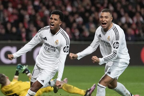 Real Madrid's Rodrygo, left, celebrates with his teammate Kylian Mbappe after scoring his side's third goal during the Champions League opening phase soccer match between Brest and Real Madrid at Roudourou stadium in Guingamp, France, Wednesday, Jan. 29, 2025. (AP Photo/Thibault Camus)