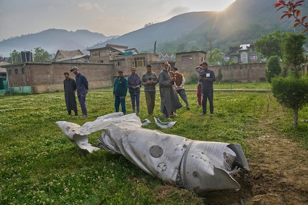 Debris of an aircraft lie at the backyard of a house at Pampore in Pulwama district of Indian controlled Kashmir, Wednesday, May 7, 2025. (AP Photo/Dar Yasin)