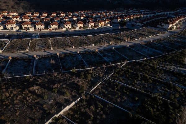 General view of developable plots in a residential area of the village of Bustarviejo, outskirts of Madrid, Spain, Tuesday, Jan. 14, 2025. (AP Photo/Bernat Armangue)