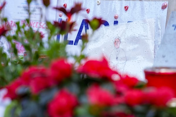 Candles and flowers for Pope Francis are seen at the Agostino Gemelli Polyclinic, in Rome, Wednesday, Feb. 26, 2025, where the Pontiff is hospitalized since Friday, Feb. 14. (AP Photo/Andrew Medichini)