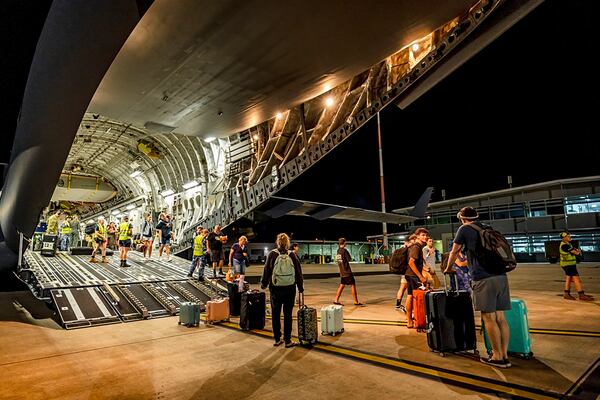 In this photo released by Australian Department of Defence, Australians disembark from an aircraft at RAAF Base Amberley, Australia after a flight home from Port Vila, Vanuatu, Wednesday, Dec. 18, 2024, following a powerful earthquake that struck just off the coast of Vanuatu in the South Pacific Ocean. (CPL Adam Abela/Australian Department of Defence via AP)