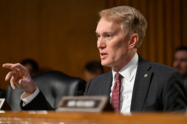 Sen. James Lankford, R-Okla., questions former Rep. Tulsi Gabbard, President Donald Trump's choice to be the Director of National Intelligence, during the Senate Intelligence Committee hearings for her confirmation at the U.S. Capitol, Thursday, Jan. 30, 2025, in Washington. (AP Photo/John McDonnell)