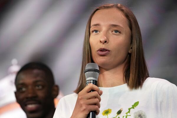 Title holder Iga Swiatek, of Poland, speaks during the draw of French Open tennis tournament, Thursday, May 22, 2025 at the Roland Garros stadium in Paris. (AP Photo/Christophe Ena)