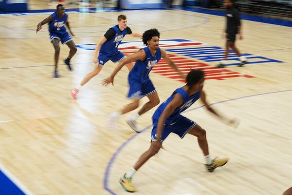 Khaman Maluach, from rear left, and Cooper Flagg, Dylan Harper and Tre Johnson participate in the 2025 NBA basketball draft combine in Chicago, Tuesday, May 13, 2025. (AP Photo/Nam Y. Huh)
