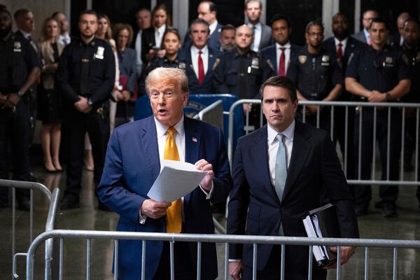 FILE - Former President Donald Trump, left, standing with defense attorney Todd Blanche, speaks at the conclusion of proceedings for the day at his trial at Manhattan criminal court, May 14, 2024, in New York. (AP Photo/Craig Ruttle, Pool, File)