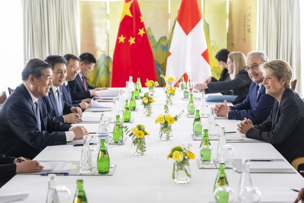 Chinese Vice Premier He Lifeng, left, Switzerland's Economy Minister Federal Councillor Guy Parmelin, center, Switzerland's President Karin Keller-Sutter, right, speak, during a bilateral meeting between Switzerland and China, in Geneva, Switzerland, on Friday, May 9, 2025. (Martial Trezzini/Keystone via AP, Pool)