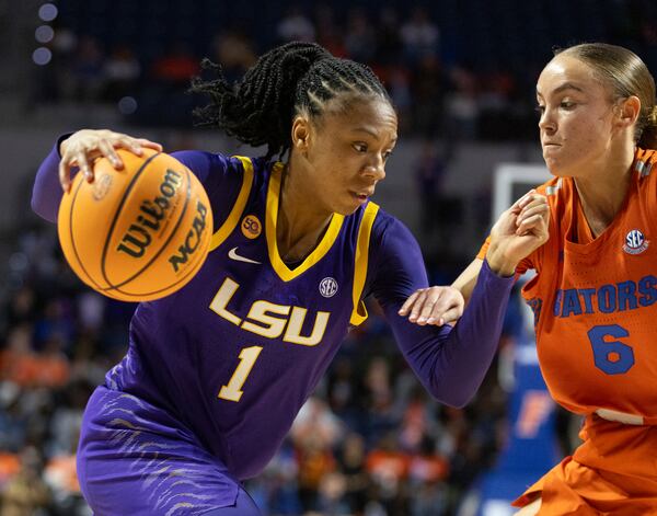 LSU guard Mjracle Sheppard (1) drives on Florida guard Kenza Salgues (6) during the second half an NCAA college basketball game Sunday, Jan. 19, 2025, in Gainesville, Fla. (AP Photo/Alan Youngblood)