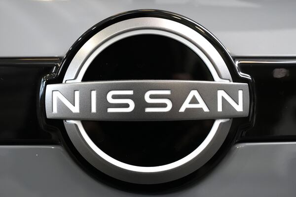 FILE - A Nissan logo is displayed on a Nissan Pathfinder SUV at the Pittsburgh International Auto Show in Pittsburgh, Feb. 15, 2024. (AP Photo/Gene J. Puskar, File)