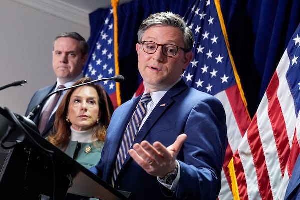 House Speaker Mike Johnson, R-La., center, joined from left by Rep. Jeff Hurd, R-Colo., and Republican Conference Chair Lisa McClain, R-Mich., during a news conference at the Republican National Committee headquarters in Washington, Wednesday, Jan. 22, 2025. (AP Photo/J. Scott Applewhite)