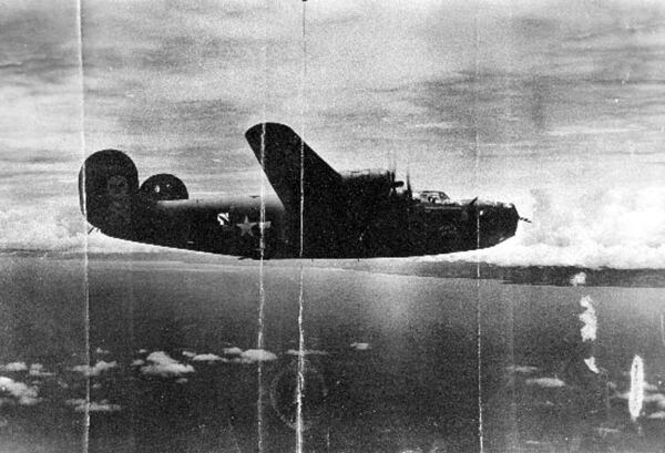 This undated photo shows the World War II B-24 bomber, Heaven Can Wait, that went down in the waters of Hansa Bay, Papua New Guinea in 1944. (Defense POW/MIA Accounting Agency via AP)