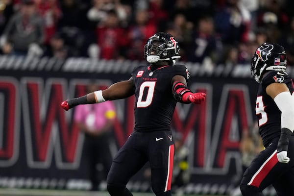 Houston Texans' Azeez Al-Shaair (0) celebrates after making a tackle against the Los Angeles Chargers during the second half of an NFL wild-card playoff football game Saturday, Jan. 11, 2025, in Houston. (AP Photo/Eric Christian Smith)