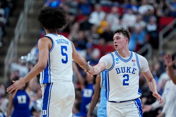 Duke forward Cooper Flagg celebrates after a basket by guard Tyrese Proctor against Mount St. Mary's during the second half in the first round of the NCAA college basketball tournament, Friday, March 21, 2025, in Raleigh, N.C. (AP Photo/Chris Carlson)