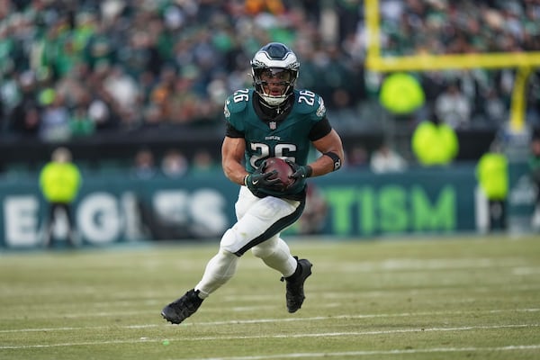 Philadelphia Eagles running back Saquon Barkley rushes for a gain against the Washington Commanders during the first half of the NFC Championship NFL football game, Sunday, Jan. 26, 2025, in Philadelphia. (AP Photo/Matt Slocum)