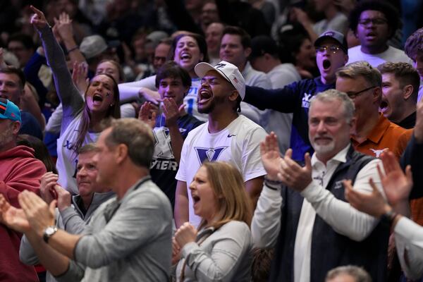 Xavier fans react during the second half of a First Four college basketball game against Texas in the NCAA Tournament, Wednesday, March 19, 2025, in Dayton, Ohio. (AP Photo/Jeff Dean)