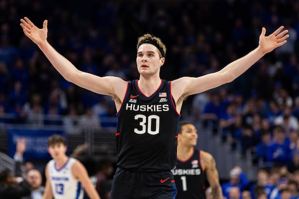 UConn forward Liam McNeeley (30) celebrates during the second half of an NCAA college basketball game against Creighton, Tuesday, Feb. 11, 2025, in Omaha, Neb. (AP Photo/Bonnie Ryan)