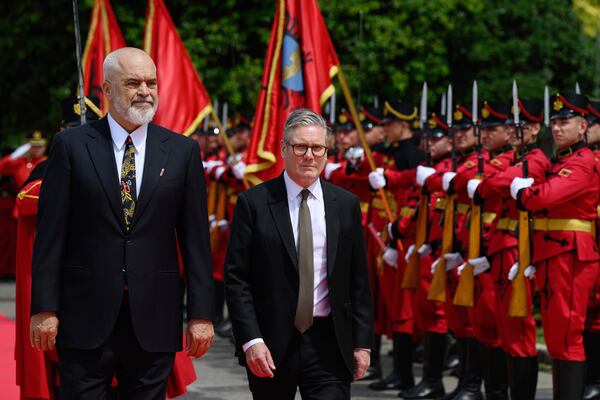 Britain's Prime Minister Keir Starmer, right, is welcomed by Albania's Prime Minister Edi Rama at the Kryeministria in Tirana, Albania, Thursday May 15, 2025. (Leon Neal/Pool via AP)
