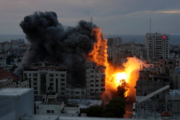 FILE - A ball of fire and smoke rise from an explosion on a Palestinian apartment tower following an Israeli air strike in Gaza City, Oct. 7, 2023. (AP Photo/Adel Hana, File)