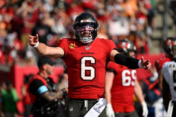 Tampa Bay Buccaneers quarterback Baker Mayfield (6) celebrates his touchdown pass during the second half of an NFL football game against the New Orleans Saints Sunday, Jan. 5, 2025, in Tampa, Fla. (AP Photo/Jason Behnken)