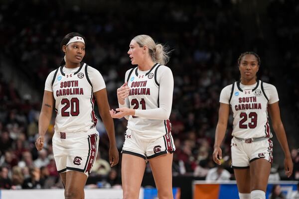 South Carolina forward Sania Feagin (20), South Carolina forward Chloe Kitts (21) and South Carolina guard Bree Hall (23) enter the court during the second half in the first round of the NCAA college basketball tournament, Friday, March 21, 2025, in Columbia, S.C. (AP Photo/David Yeazell)