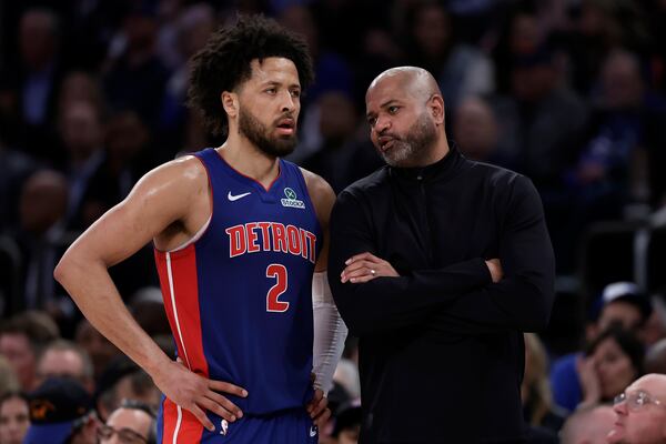 Detroit Pistons head coach J.B. Bickerstaff talks to Cade Cunningham (2) in the second half during Game 5 in an NBA basketball first-round playoff series against the New York Knicks, Tuesday, April 29, 2025, in New York. (AP Photo/Adam Hunger)