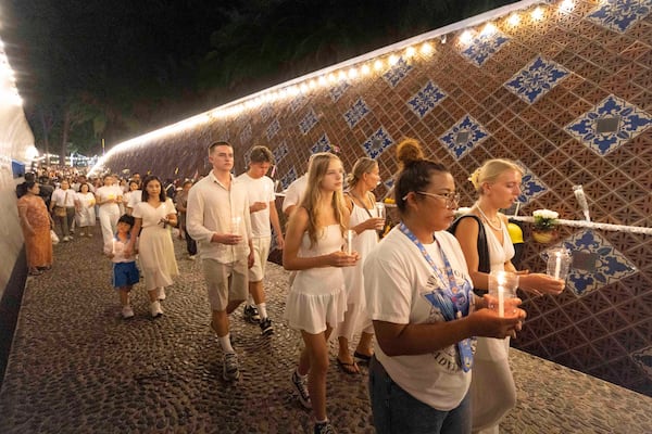 Relatives of victims of the 2004 Indian Ocean tsunami hold a candle light vigil as they participate in the 20th anniversary, at Tsunami Memorial Park at Ban Nam Khem, Takuapa district of Phang Nga province, southern Thailand, Thursday, Dec. 26, 2024. (AP Photo/Wason Wanichakorn)