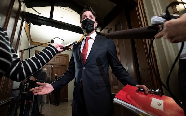 FILE - Prime Minister Justin Trudeau gestures as he speaks with reporters before caucus on Parliament Hill, in Ottawa, on Nov. 24, 2021. (Adrian Wyld/The Canadian Press via AP, File)