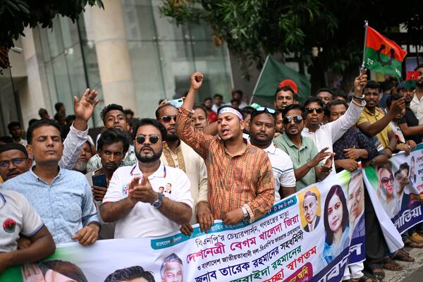 Supporters of Bangladesh's ailing former Prime Minister Khaleda Zia shout slogans as they welcome her arrival from London, in Dhaka, Bangladesh, Tuesday, May 6, 2025. (AP Photo/Mahud Hossain Opu)