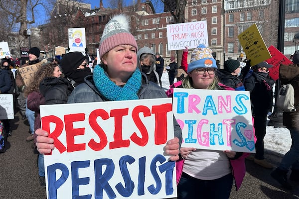 Demonstrators join more than a thousand people protesting the policies of the Trump administration marched from the Boston Common past City Hall to the North End, Monday, Feb. 17, 2025 in Boston. (AP/Michael Casey)