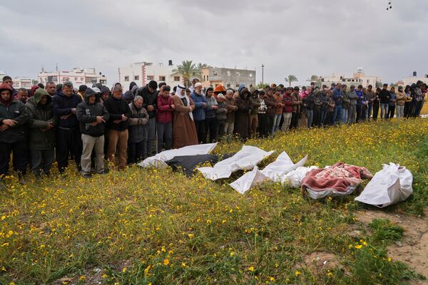 Palestinians pray during a funeral for victims of Israeli army strikes in Khan Younis, southern Gaza Strip, Thursday, March 20, 2025. (AP Photo/Abdel Kareem Hana)