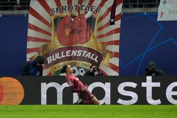 Leipzig's Yussuf Poulsen celebrates after scoring his side's second goal during the Champions League soccer match between RB Leipzig and Sporting CP at the RB Arena in Leipzig, Germany, Wednesday, Jan. 22, 2025. (AP Photo/Matthias Schrader)