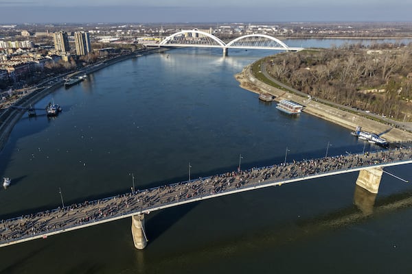 People block the Varadin bridge during a protest over the collapse of a concrete canopy killed 15 people more than two months ago, in Novi Sad, Serbia, Saturday, Feb. 1, 2025. (AP Photo/Armin Durgut)